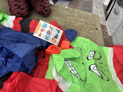 Grinch blow suit holding - blow,